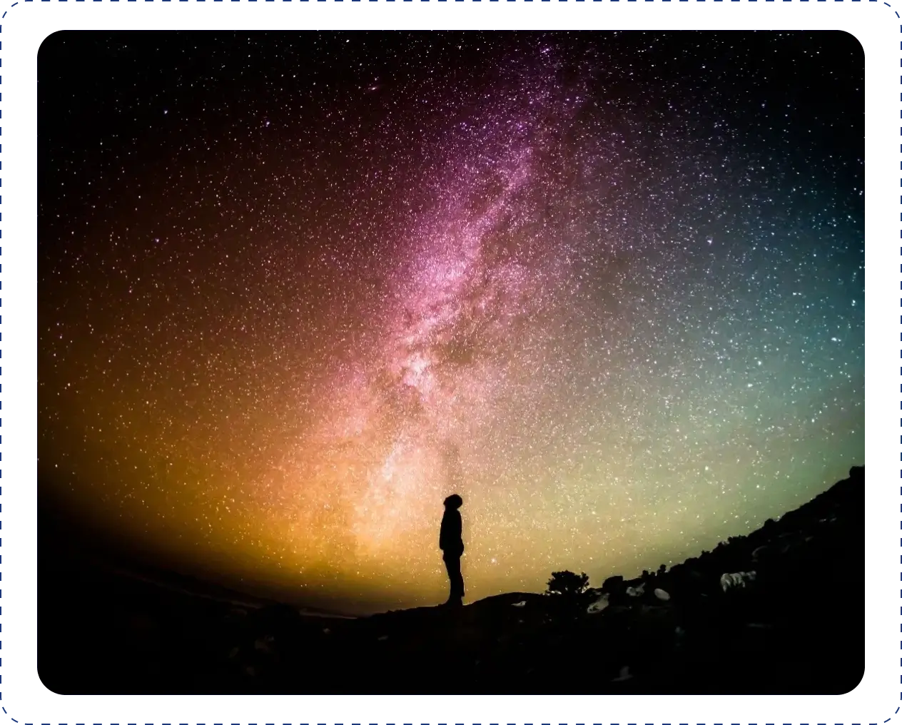 Silhouette under colorful starry sky